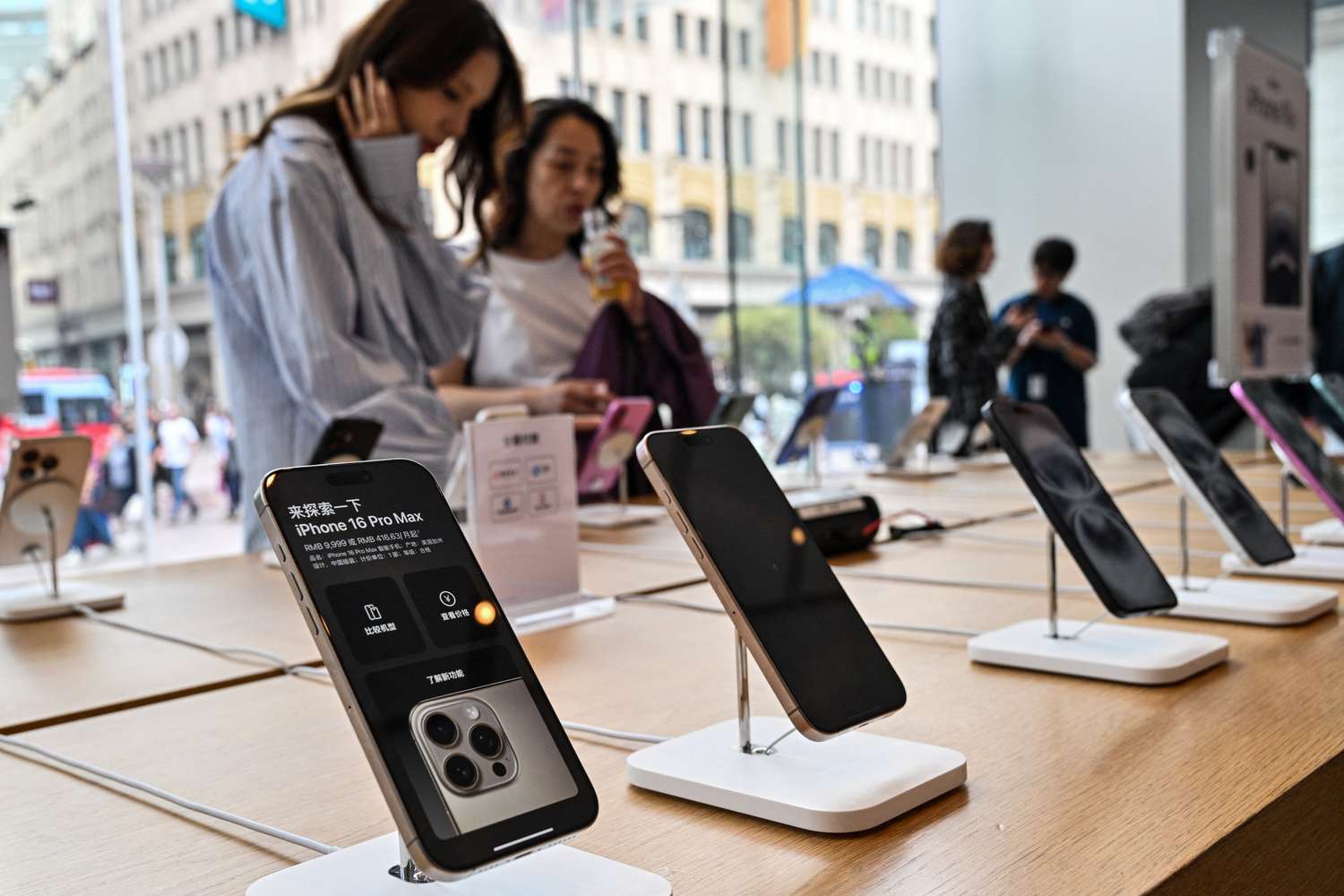 Trump Exempts Smartphones and Computers from Tariffs 3 July 27, 2025 3:00 pm Trump Exempts Smartphones and Computers from Tariffs People browse for Iphone 16 displayed in a Apple store in the Huangpu district in Shanghai on April 11, 2025