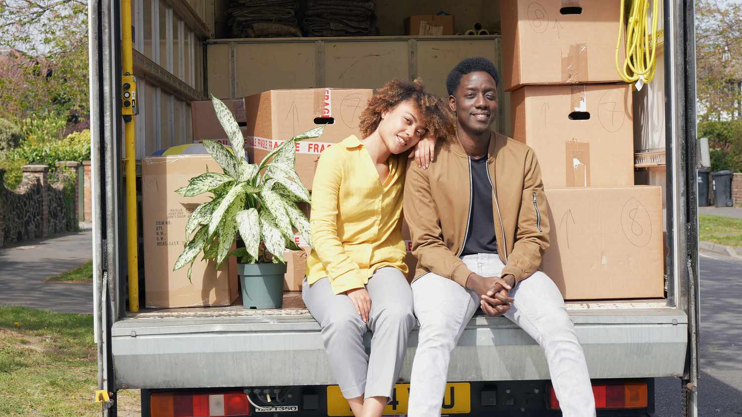 Moving Can Be Expensive—In More Ways Than You Might Expect 3 July 23, 2025 2:45 am Moving Can Be Expensive—In More Ways Than You Might Expect Couple Sitting on Back of Open Moving Van With Boxes