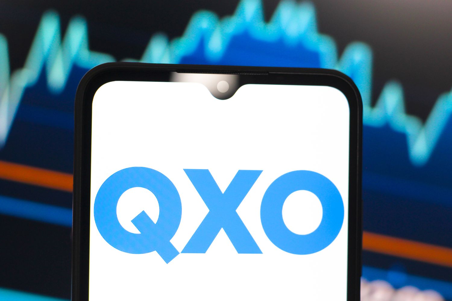 Technology Solutions Firm QXO Agrees To Buy Beacon Roofing Supply For $11B 3 April 20, 2025 1:09 am Technology Solutions Firm QXO Agrees To Buy Beacon Roofing Supply For $11B The blue QXO logo is seen on a phone screen with a light blue stock chart in the background.