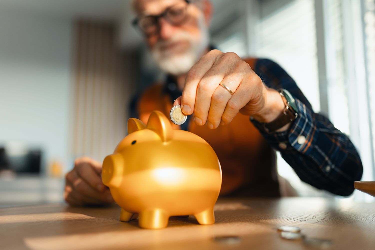 Research Suggests That Most Americans Aren't Making the Most of Their Savings Accounts 4 August 29, 2025 8:10 pm Research Suggests That Most Americans Aren't Making the Most of Their Savings Accounts A stock image of a man putting a coin into a piggy bank.