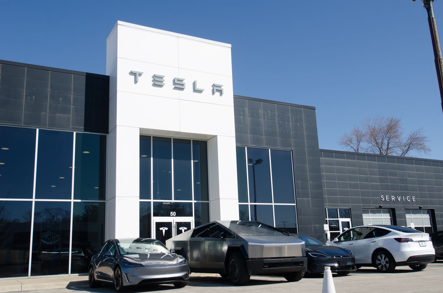 Auto stocks tumble after Trump says he 'couldn't care less' if tariffs raise prices 3 July 16, 2025 4:01 pm Auto stocks tumble after Trump says he 'couldn't care less' if tariffs raise prices Tesla vehicles are seen in front of a black and white dealership building.