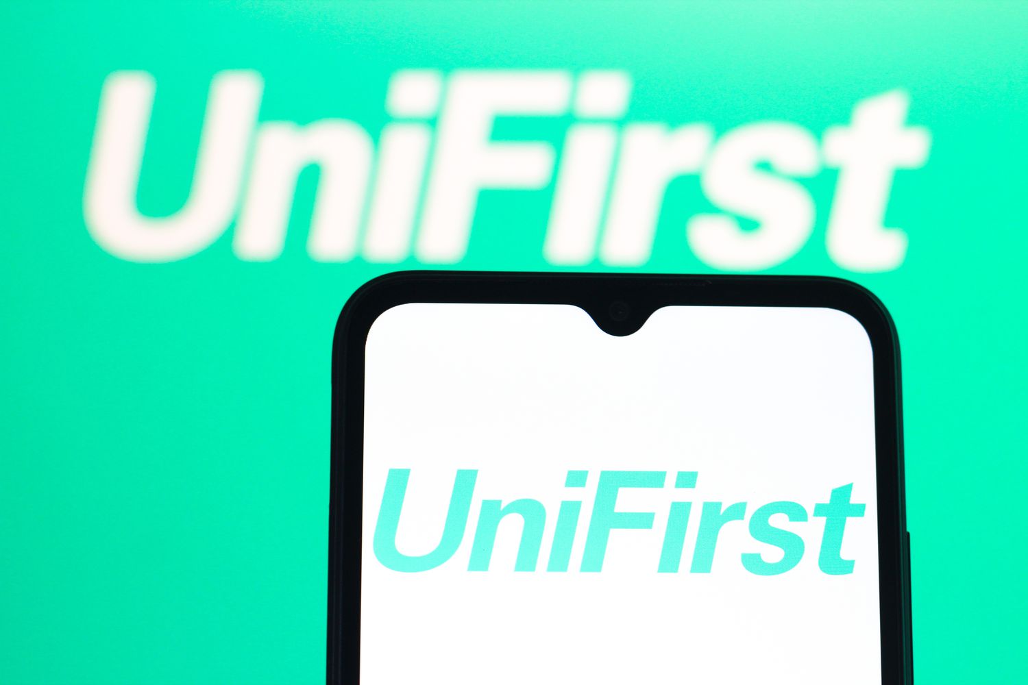 Workplace Uniforms Maker UniFirst Tops Profit Forecasts for Q2; Sales Fall Short 3 July 15, 2025 1:17 pm Workplace Uniforms Maker UniFirst Tops Profit Forecasts for Q2; Sales Fall Short The green UniFirst logo is seen on a phone screen with a larger version in the background.