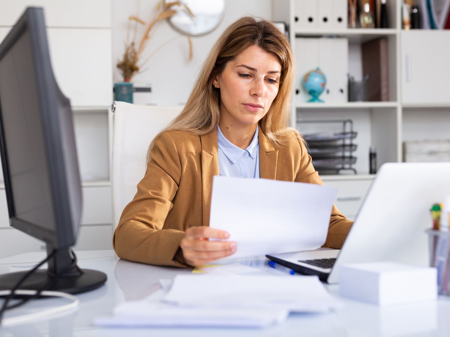 Need a Safe Haven For Your Cash In An Uncertain Economy? Here are your highest-yielding options right now 3 June 14, 2025 10:50 am Need a Safe Haven For Your Cash In An Uncertain Economy? Here are your highest-yielding options right now Woman sitting at home desk and looking at bank statements and a laptop