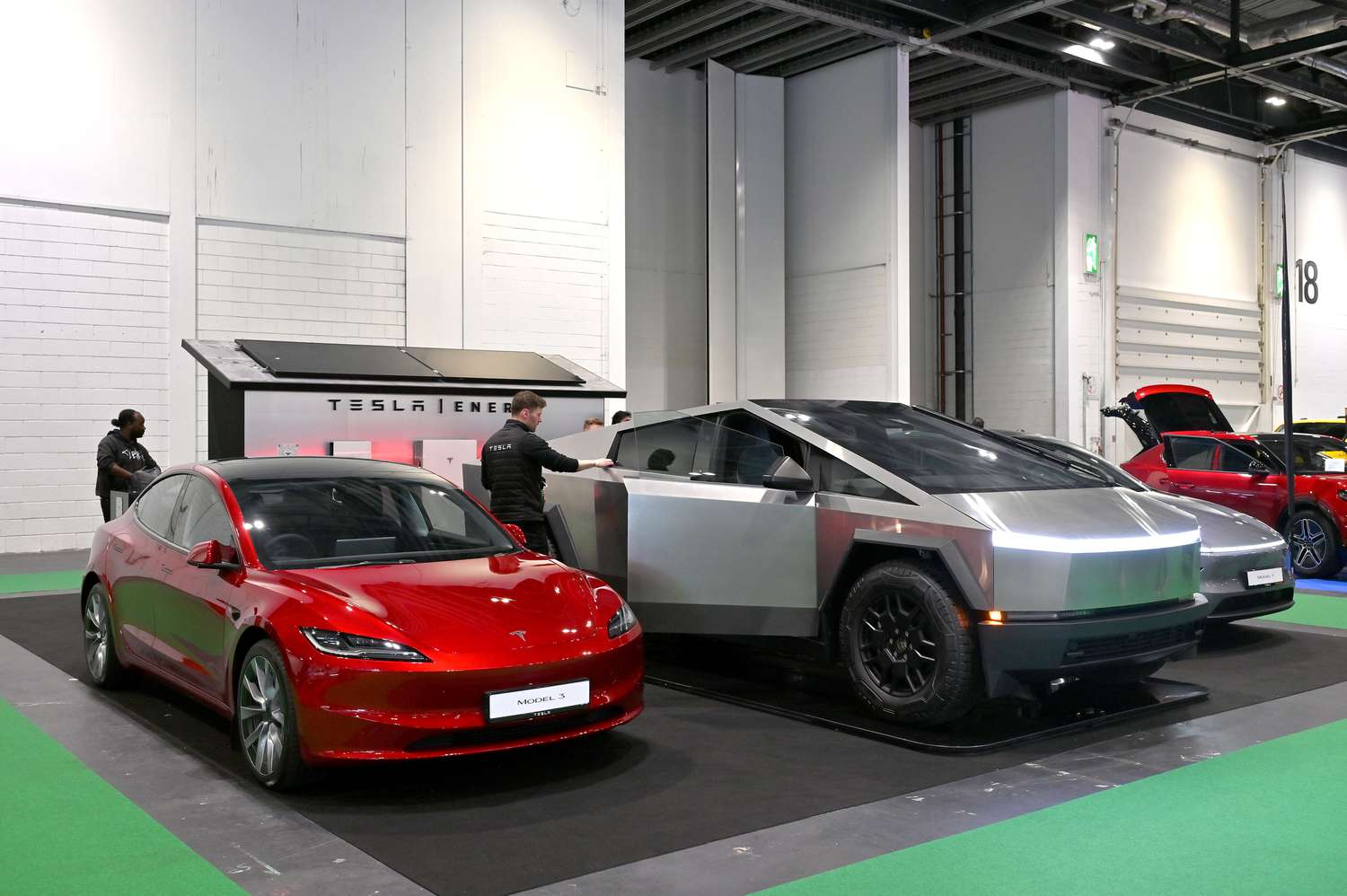 What Analysts Think About Tesla Stock Ahead Of Earnings 3 May 8, 2025 10:43 pm What Analysts Think About Tesla Stock Ahead Of Earnings Tesla vehicles are seen at a display booth in a white building.